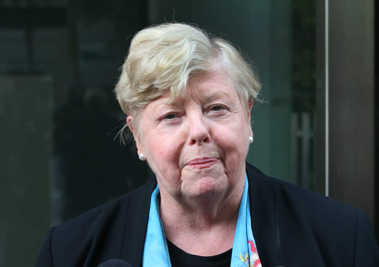 Woman smiles at the camera.