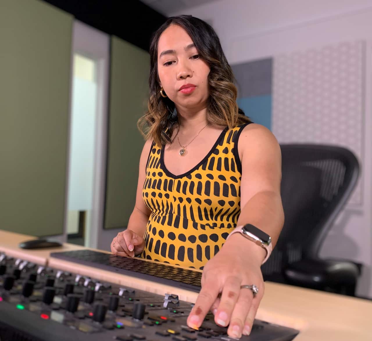 Mia at an edit desk.