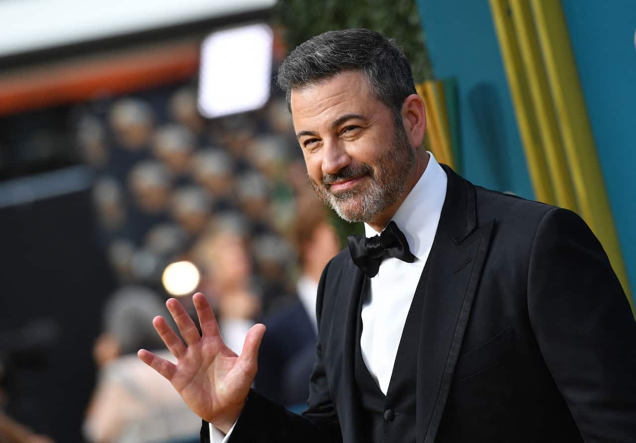 Jimmy Kimmel waves to cameras at the Emmys