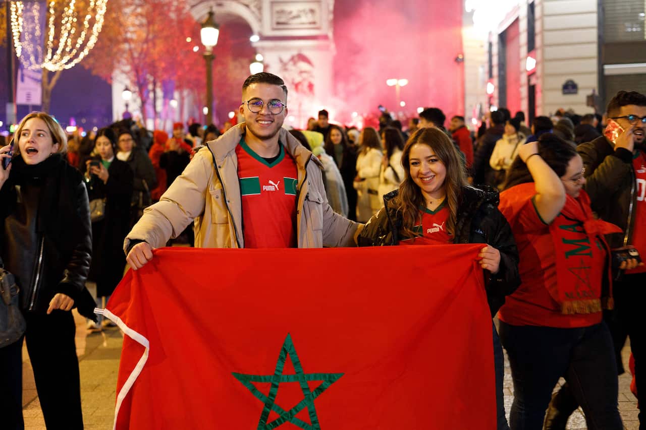 Morocco's Supporters Celebrate On The Avenue Des Champs-Elysees - Paris
