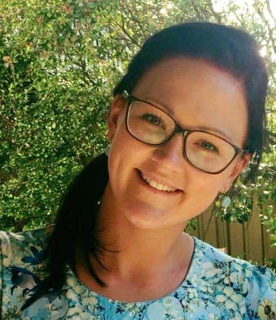 A woman wearing glasses.