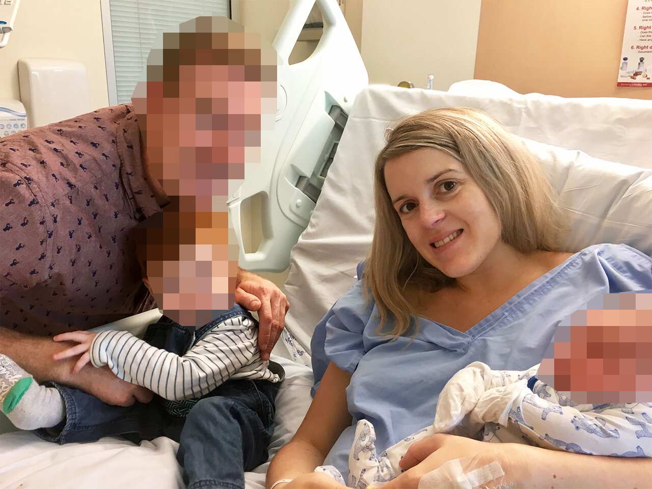 A man and a woman with two young children