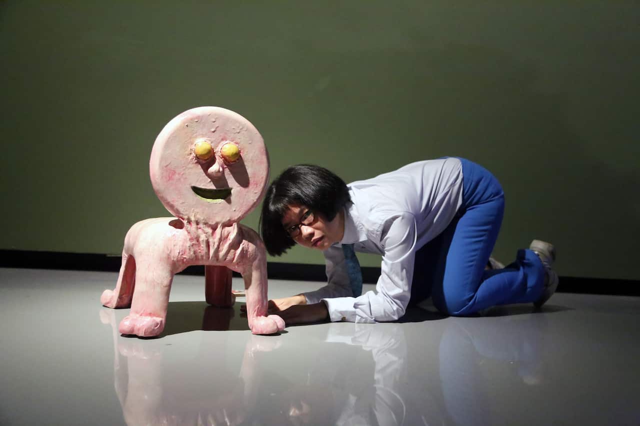 Natasha Tontey with one of her works from the installation Primate Visions Macaque Macabre at Monash University Museum of Art (MUMA), Melbourne.
