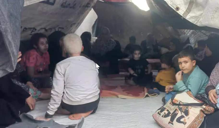 Sixteen members of the Al Hattab family, many of them children, remain in Gaza, sheltering in a makeshift tent..png
