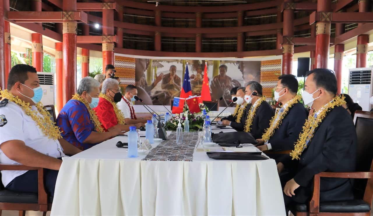 Members of Samoa's government meet with members of China's delegation.