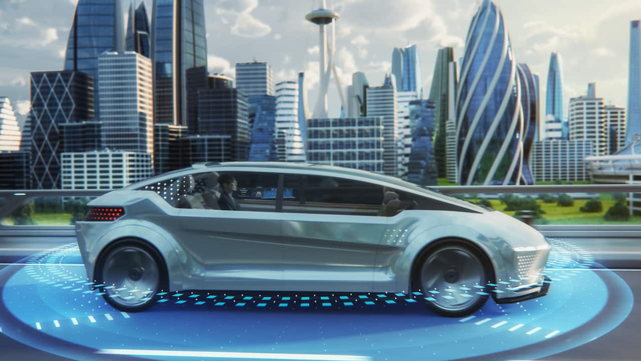 Futuristic Concept: Stylish Japanese Businessman Riding on a Back Seat of an Autonomous Self-Driving Zero-Emissions Electric Car. He is Riding on the Highway in the City of the Future.