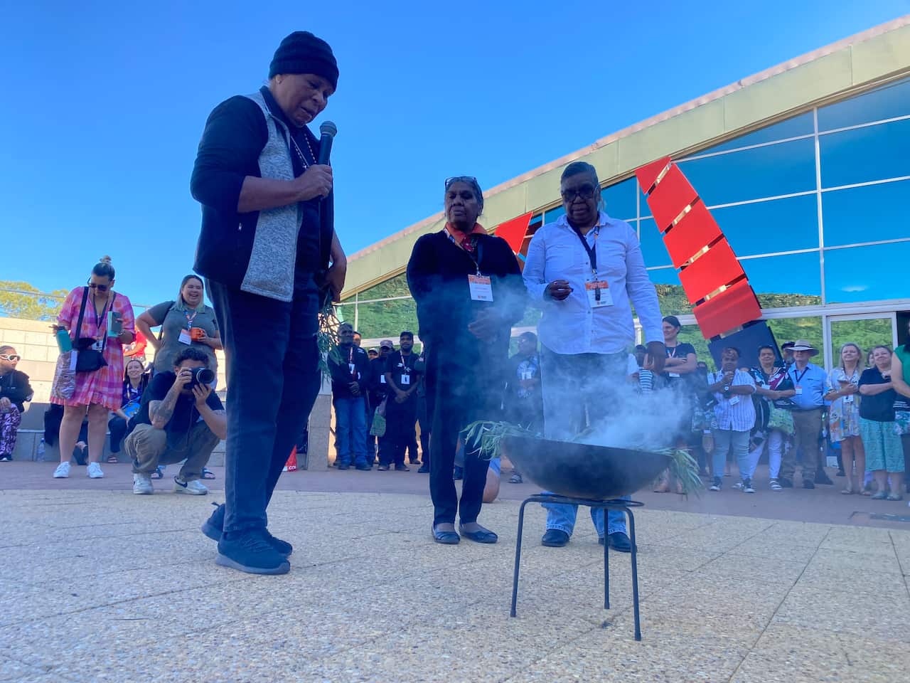 A woman delivers a Welcome to Country.