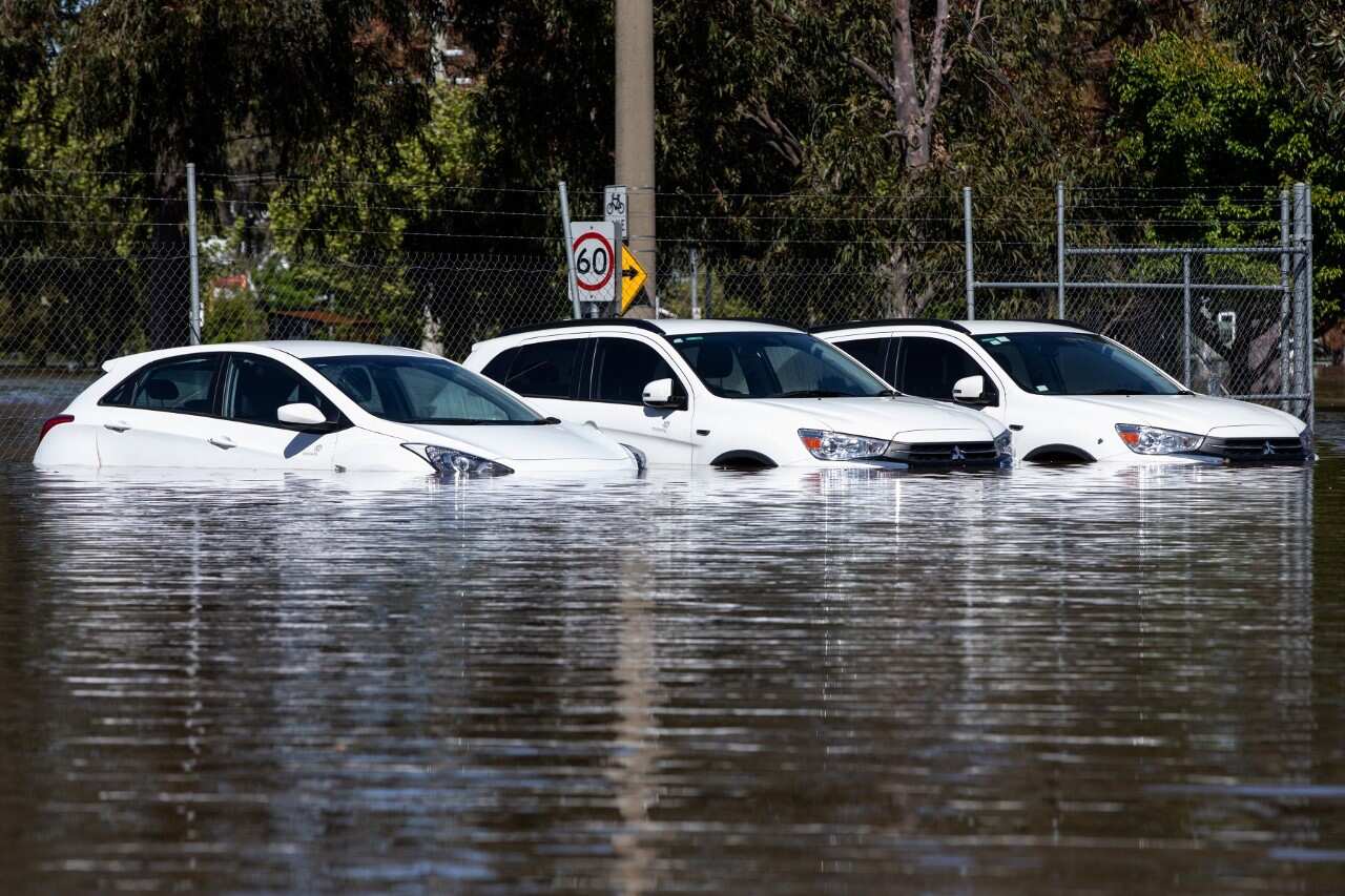Cars covered by floodwaters at Shepparton in Victoria (AAP).jpg
