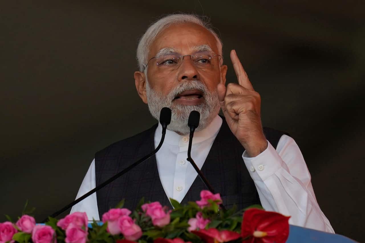 A man speaking at a podium waving his finger