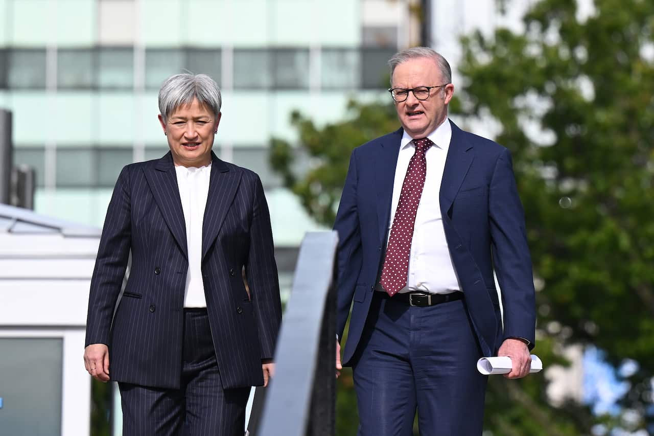 Penny Wong and Anthony Albanese walking next to each other.