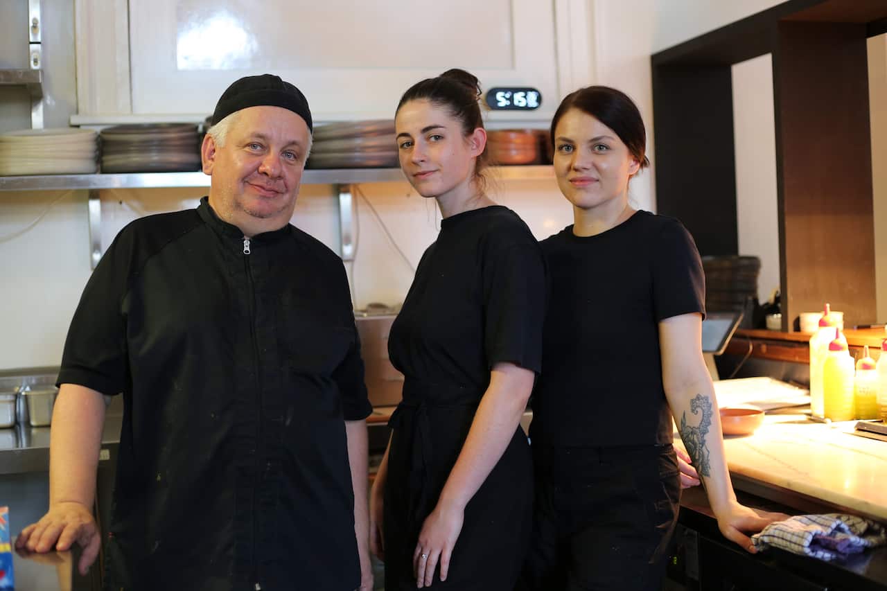 Meet three of the resettled Ukrainian refugees behind the food served at Kyïv Social: (L to R) executive chef, Borys Cherniak and sous chefs Martina Tkachenko and Viktoriia Bodnaruk.