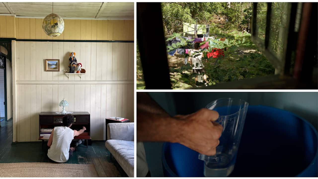 Man putting a vinyl on, getting water out of a barrel and hanging laundry.