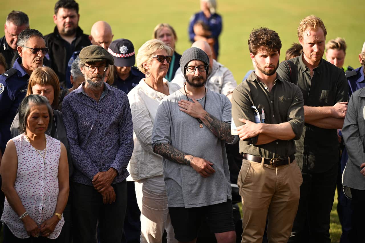 Mourners gather for a vigil.