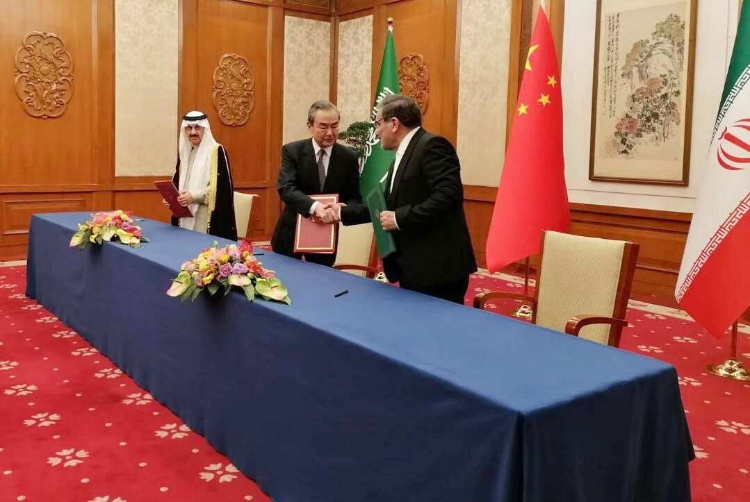 Iran's National Security Council official Ali Shamkhani, Chinese foreign affairs official Wang Yi, and Saudi Arabian national security adviser Musaid Al Aiban meet in Beijing on 10 March 2023.