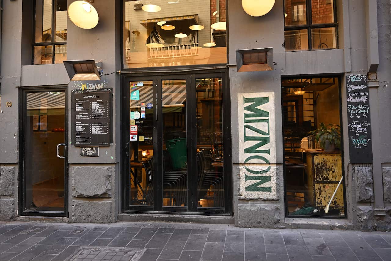 A building with a sign that reads: Miznon