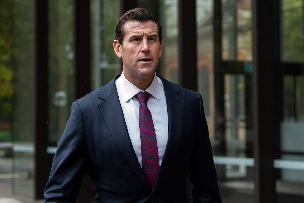 Ben Roberts-Smith walking down a street.