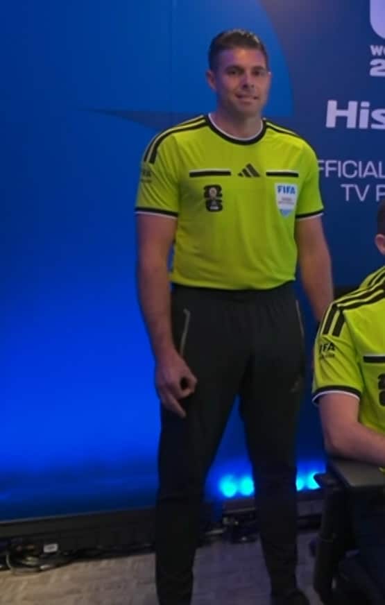 Australian football referee Shaun Evans standing in official FIFA uniform