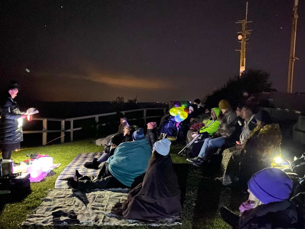 A group at Strzelecki Lookout in Newcastle to celebrate Matariki, the Maori New Year.