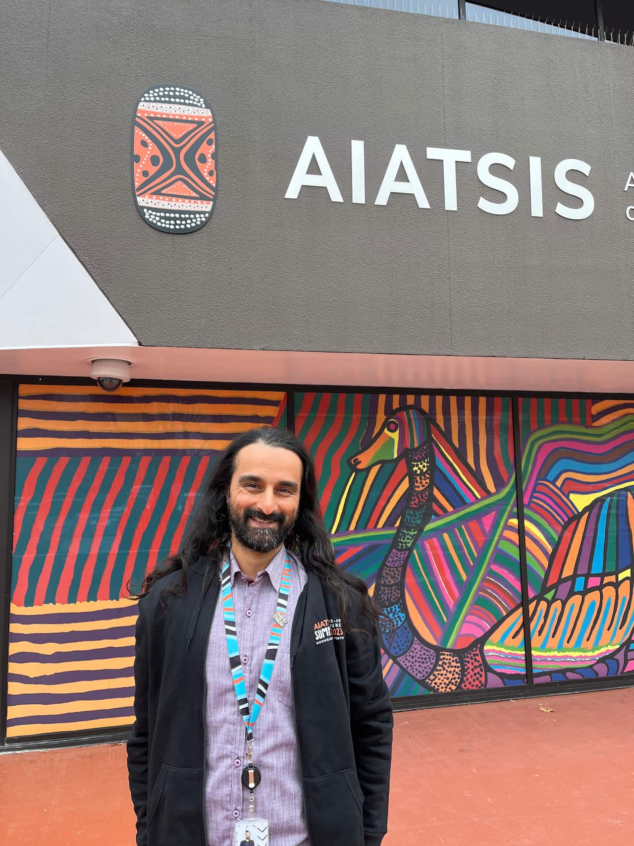 Mahesh White Radhakrishnan infront of his workplace