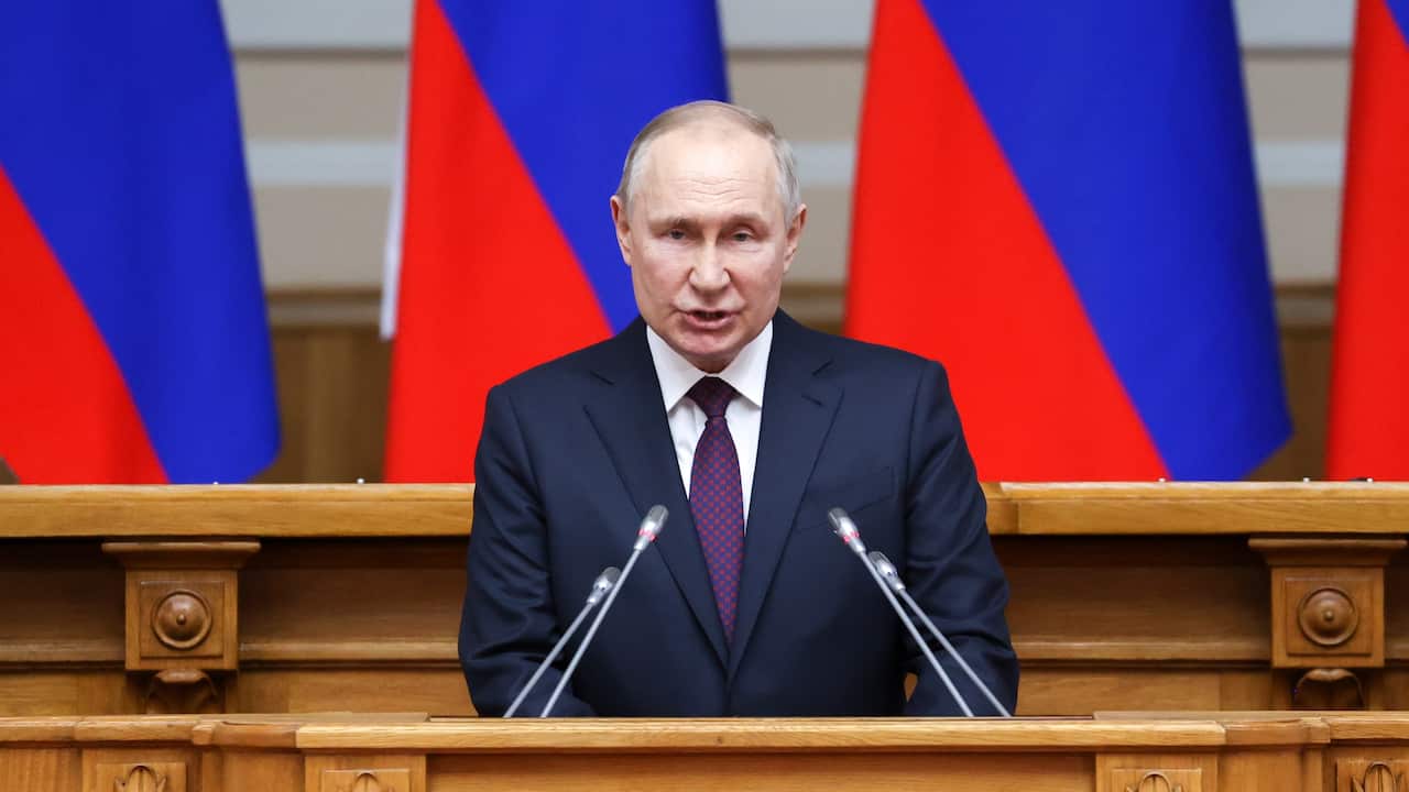 Man speaking at a lectern 