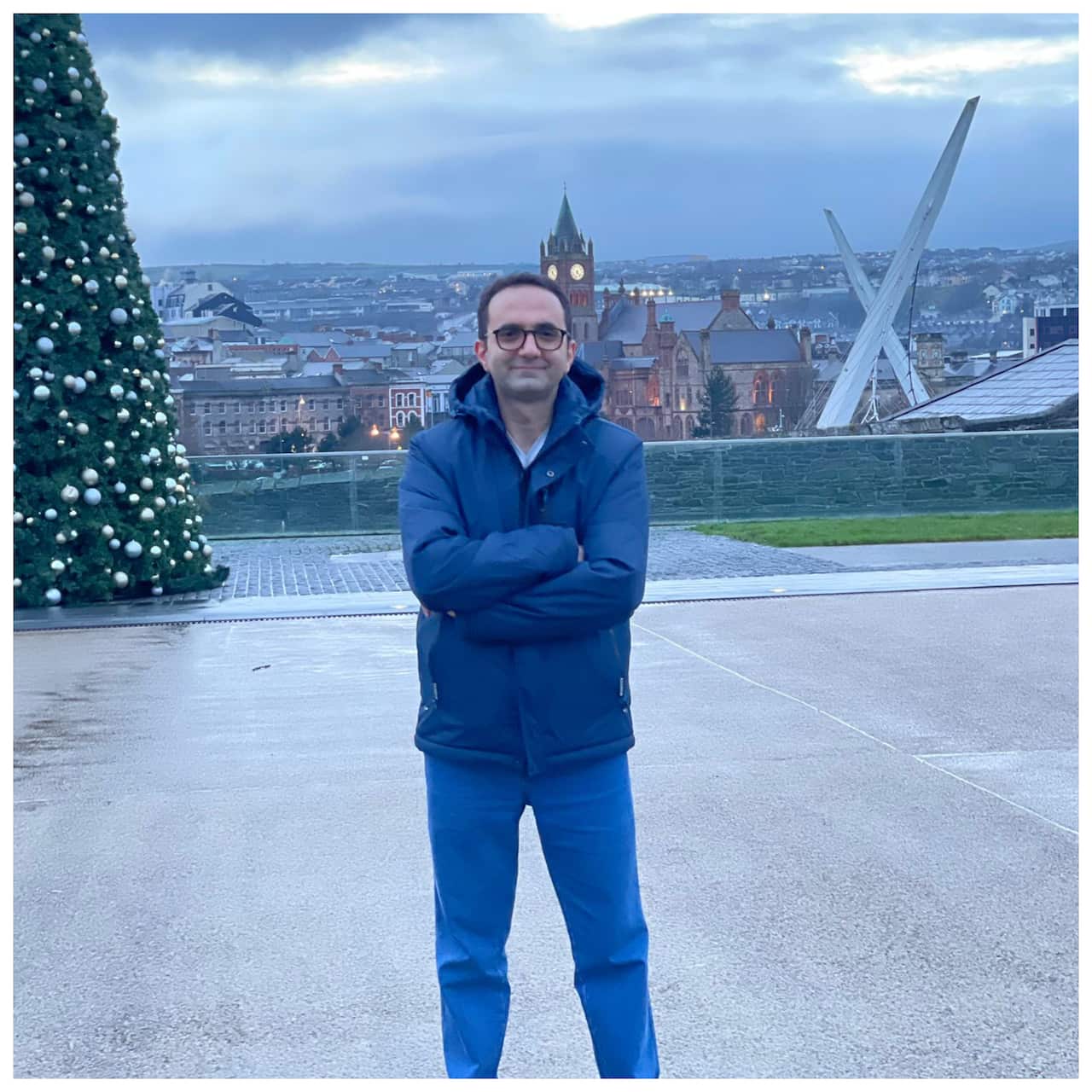A man standing with his arms crossed. 