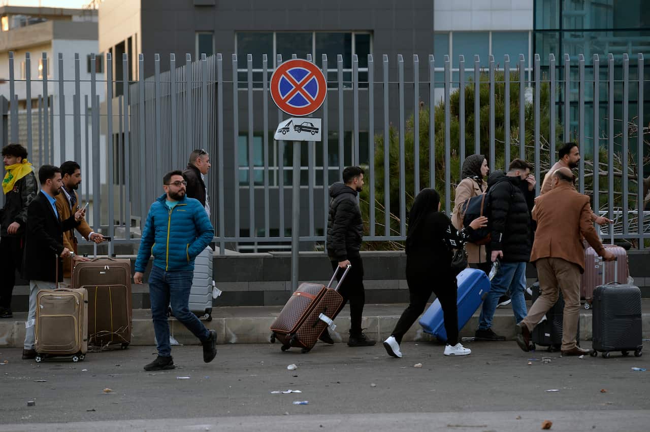 Hezbollah supporters protest at the entrance to Rafic Hariri International Airport