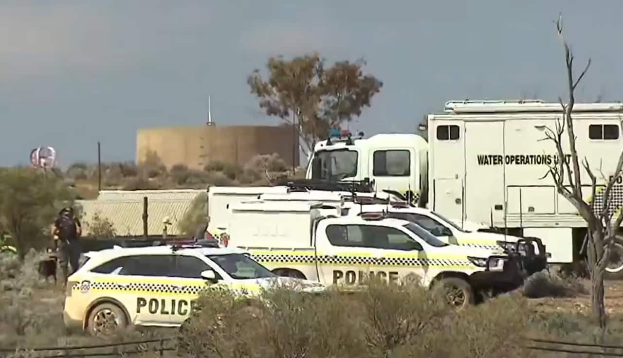 Three police cars seen at a property in rural South Australia