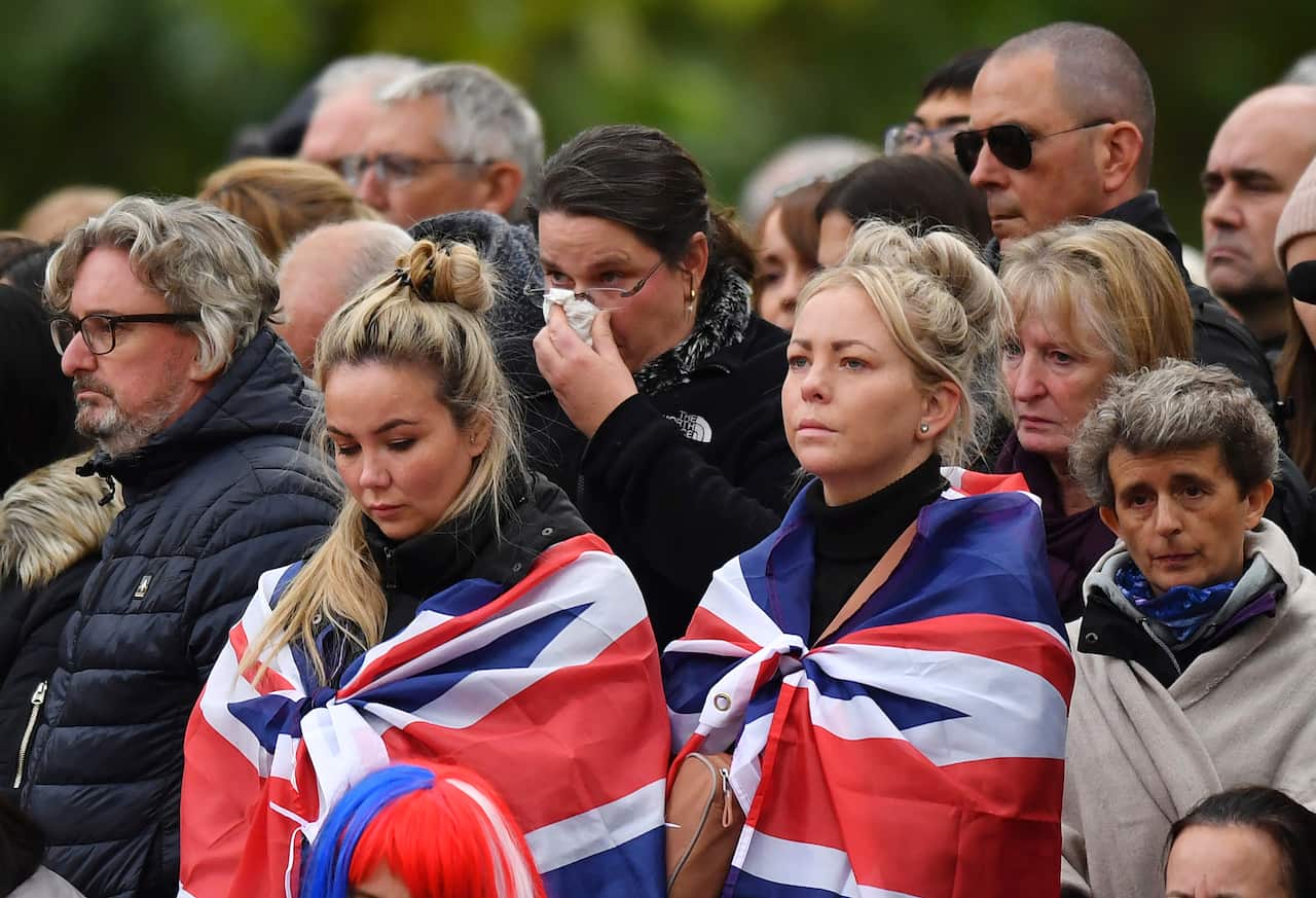 Mourners gather outside Westminster Abbey before the state funeral Queen Elizabeth II.