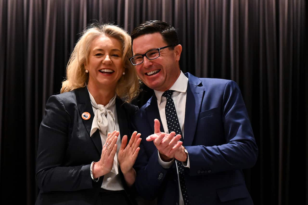 David Littleproud and Bridget McKenzie smiling and clapping