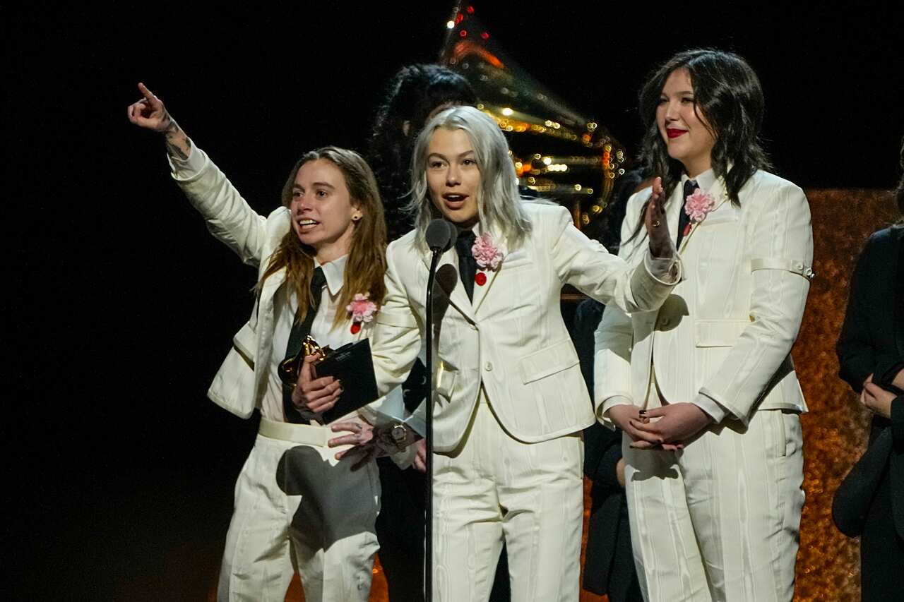 From left, Julien Baker, Phoebe Bridgers, and Lucy Dacus of Boygenius accept an award.
