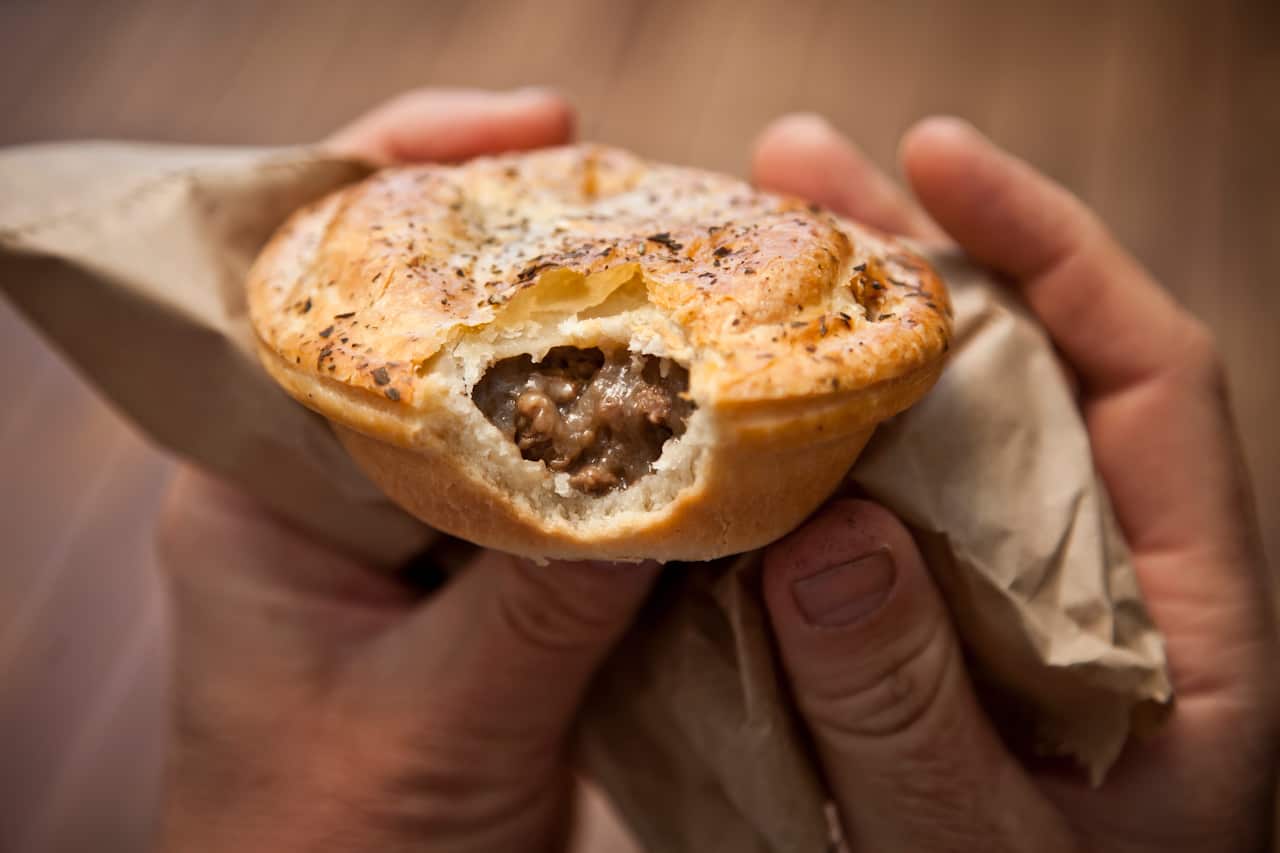 Eating a meat pie