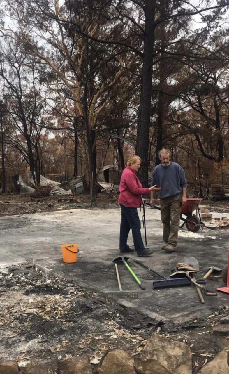 Judith and Paul Collins at their property in Buxton, NSW, after it was destroyed by a bushfire in 2019.