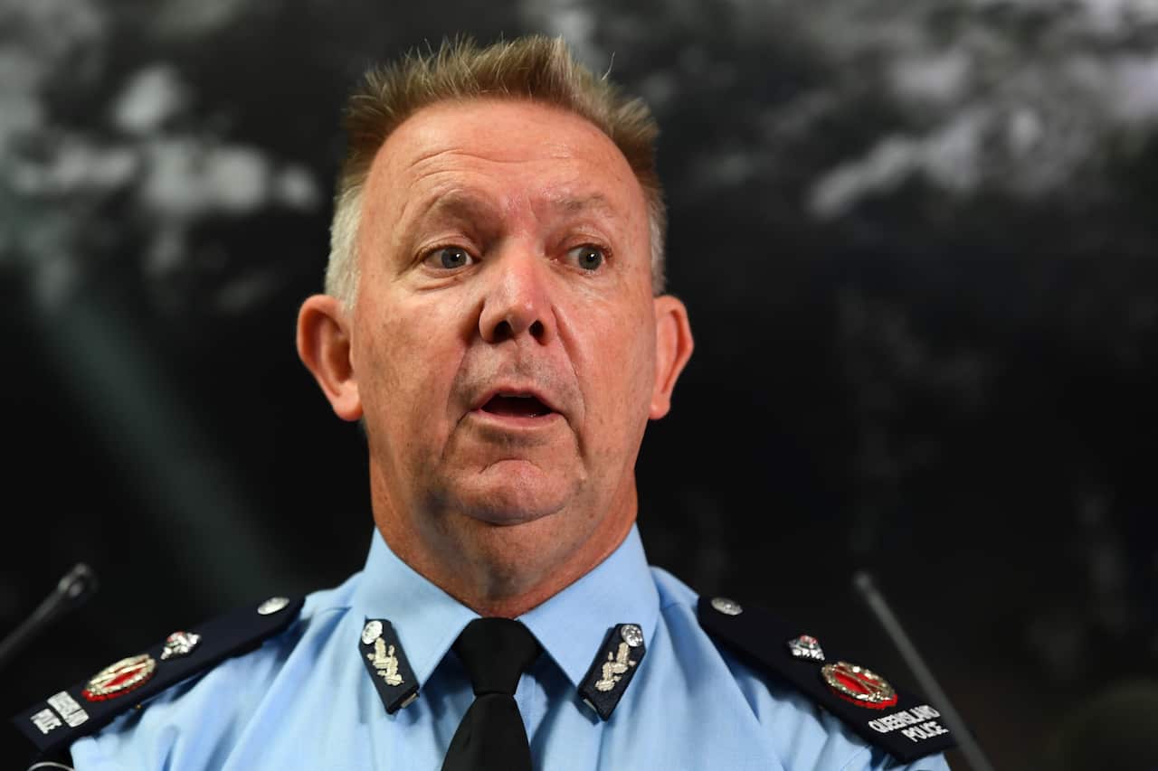 A middle-aged police officer in blue uniform speaks.