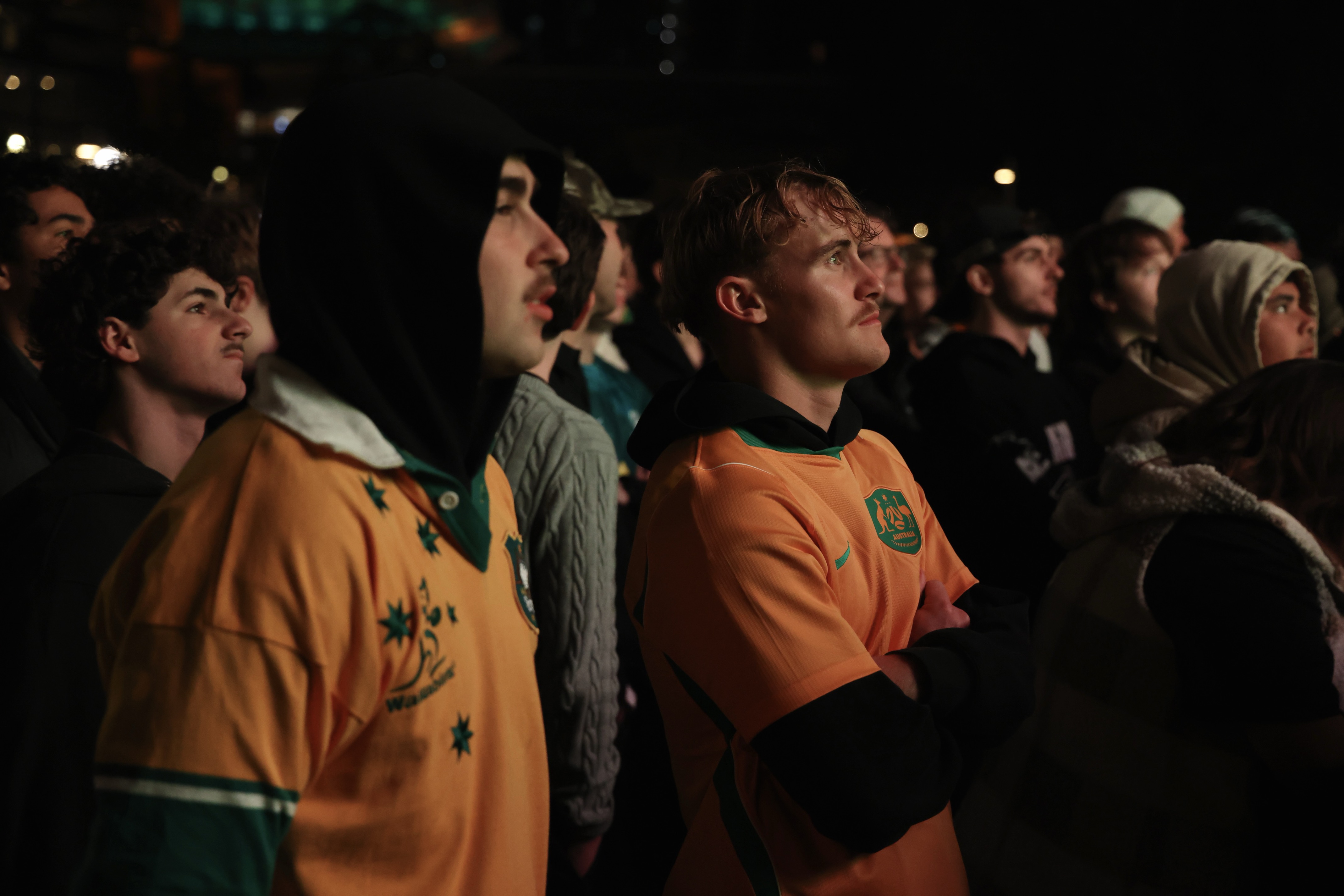 Socceroos fans standing in a park