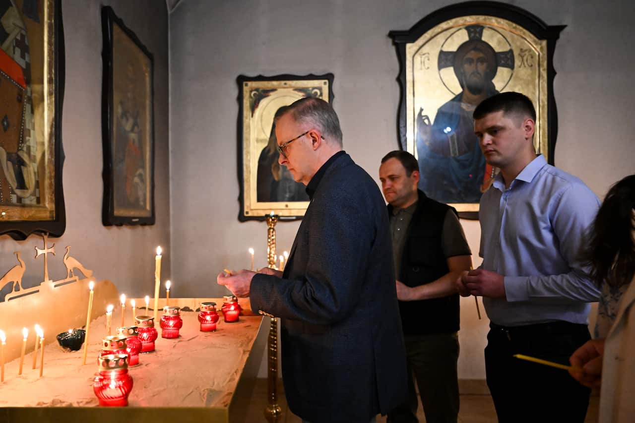 Anthony Albanese lights a candle at St. Andrews Orthodox Church in Bucha on the outskirts of Kyiv, Ukraine.