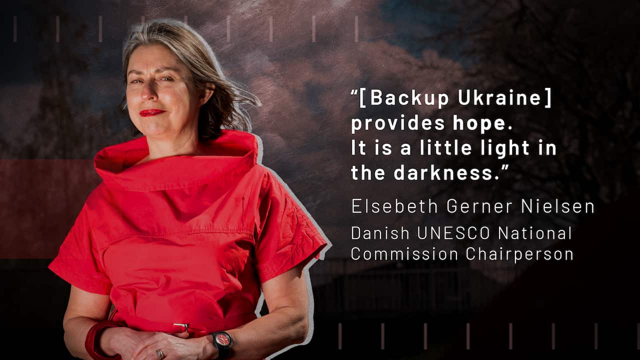 A woman wearing a red dress.