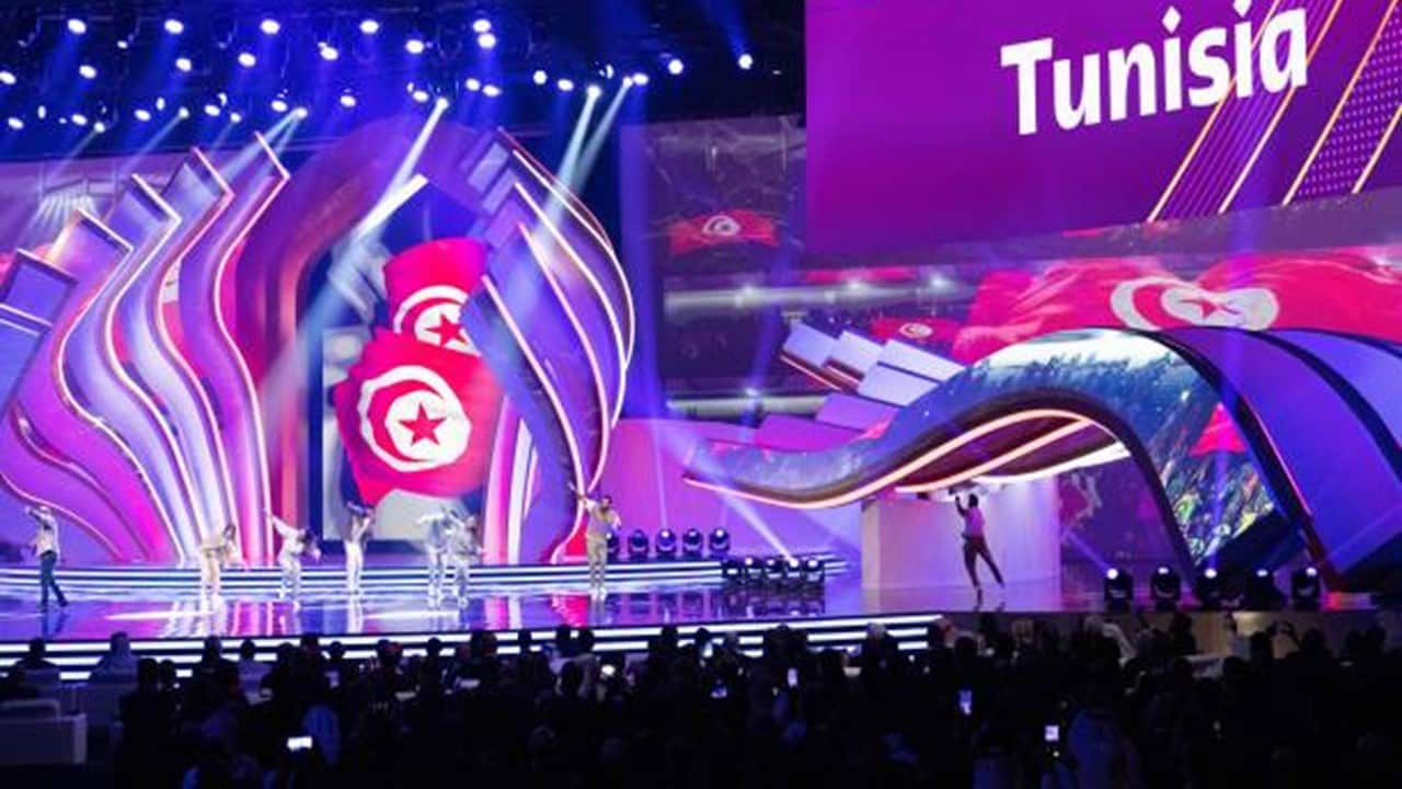 General view with Tunisia written on the screens of the Exhibition and Convention Center at Doha Exhibition Cente.jpg