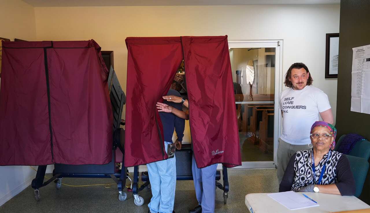 People inside a voting booth