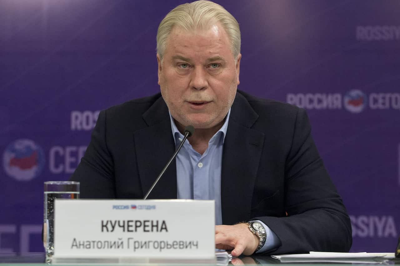 A man speak into a microphone