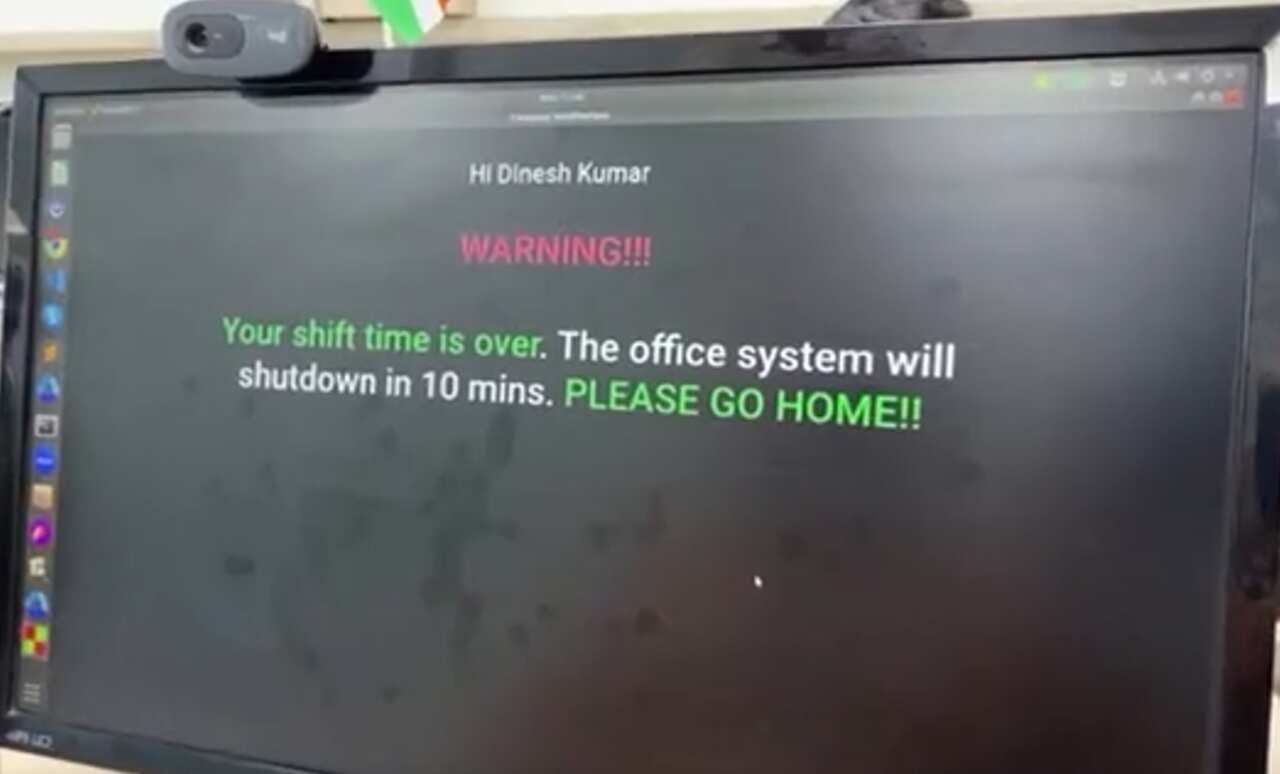 A computer screen with a message that reads: WARNING!!! Your shift time is over. The office system will shutdown in 10 mins. PLEASE GO HOME!!". 