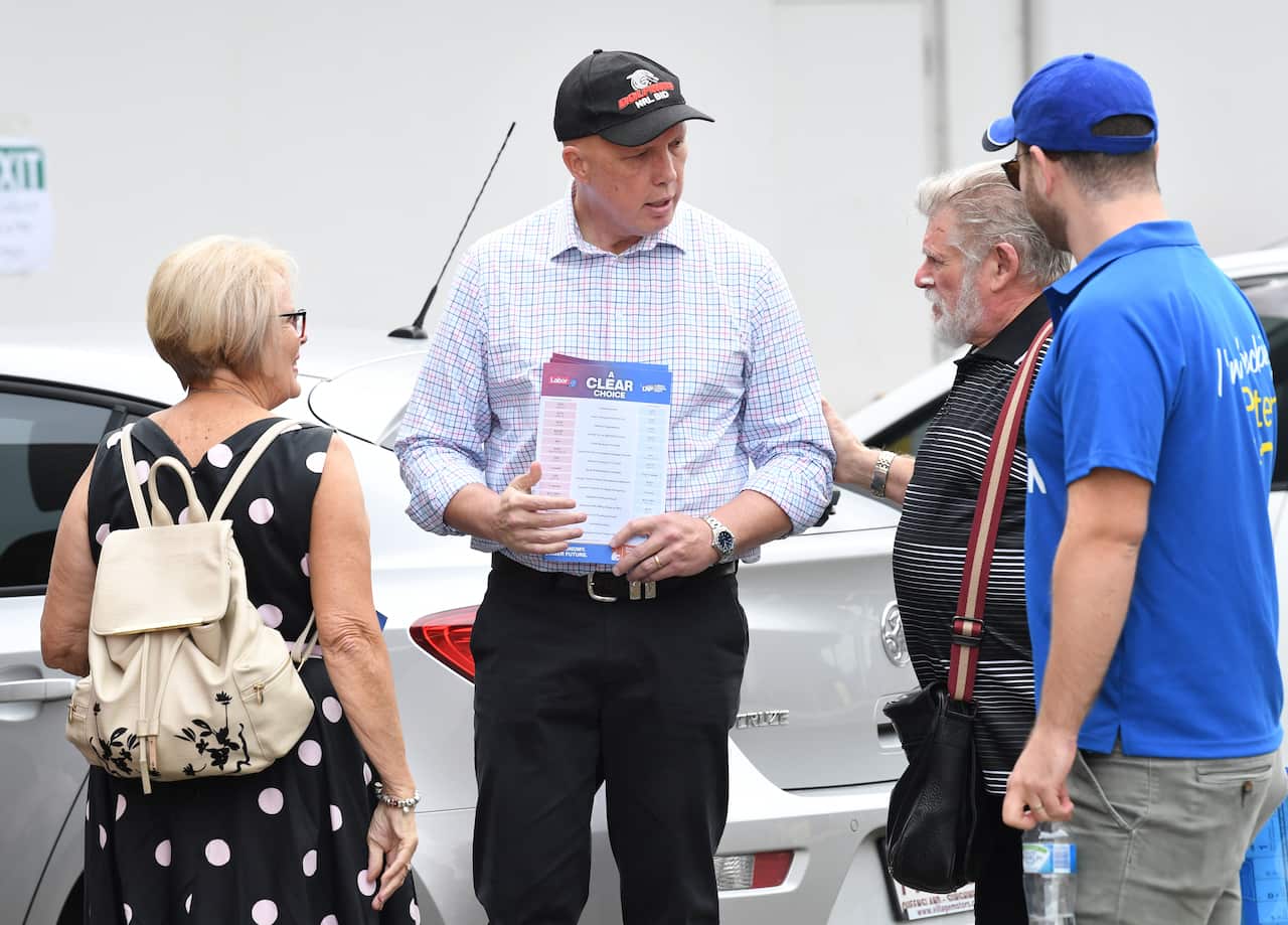 A group of four people standing outside