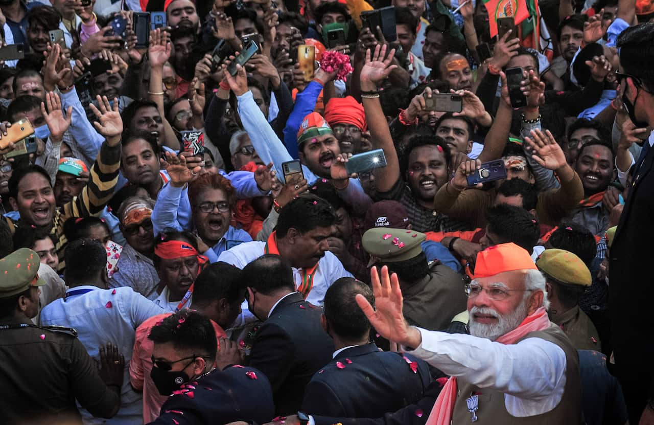 A man waving to a crowd