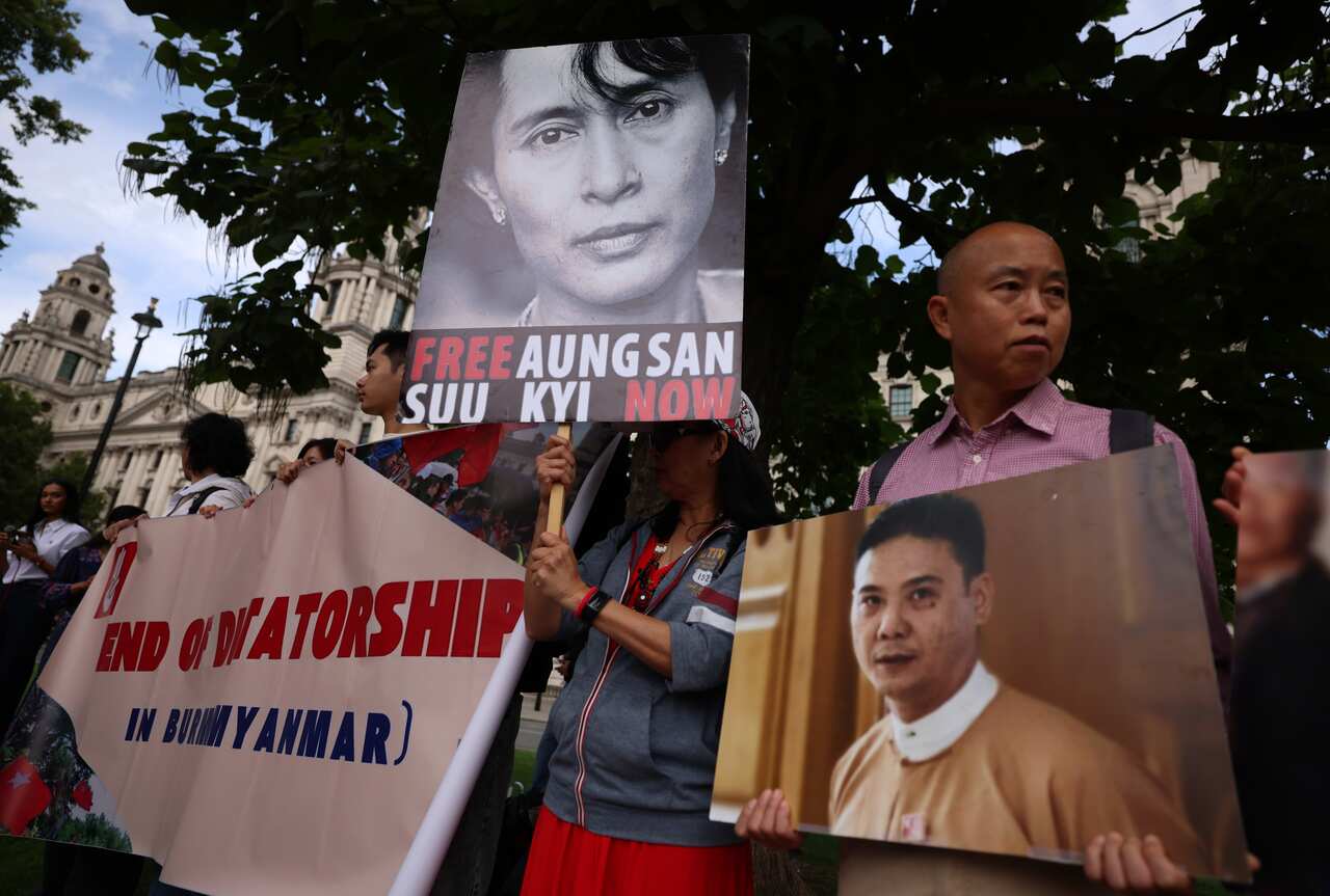 A group of protesters holding up signs.