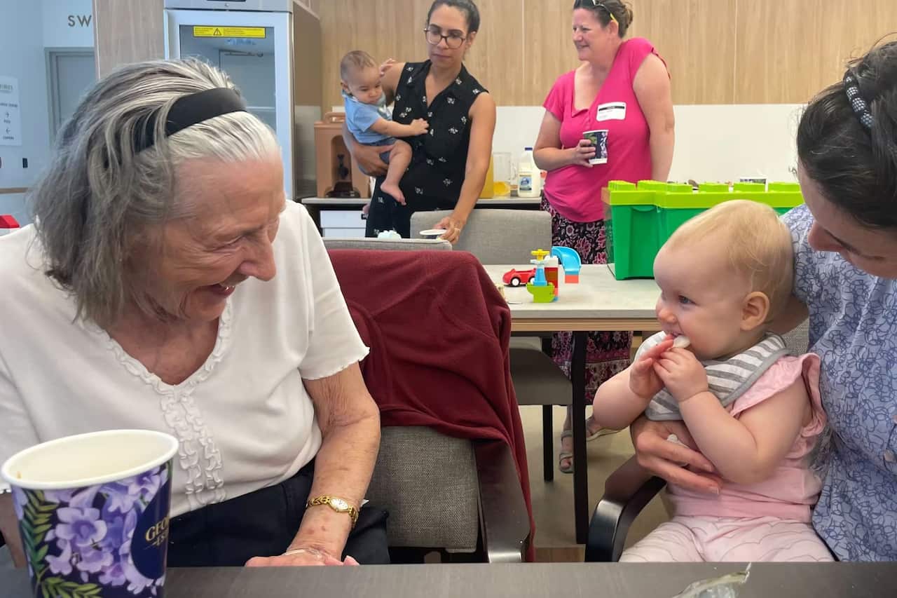 Residents at Georges Estate aged care facility enjoy time with children during a playgroup session_Rayane Tamer_SBS.jpg