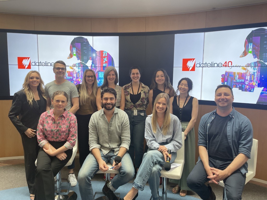 Dateline staff in two rows smiling into camera