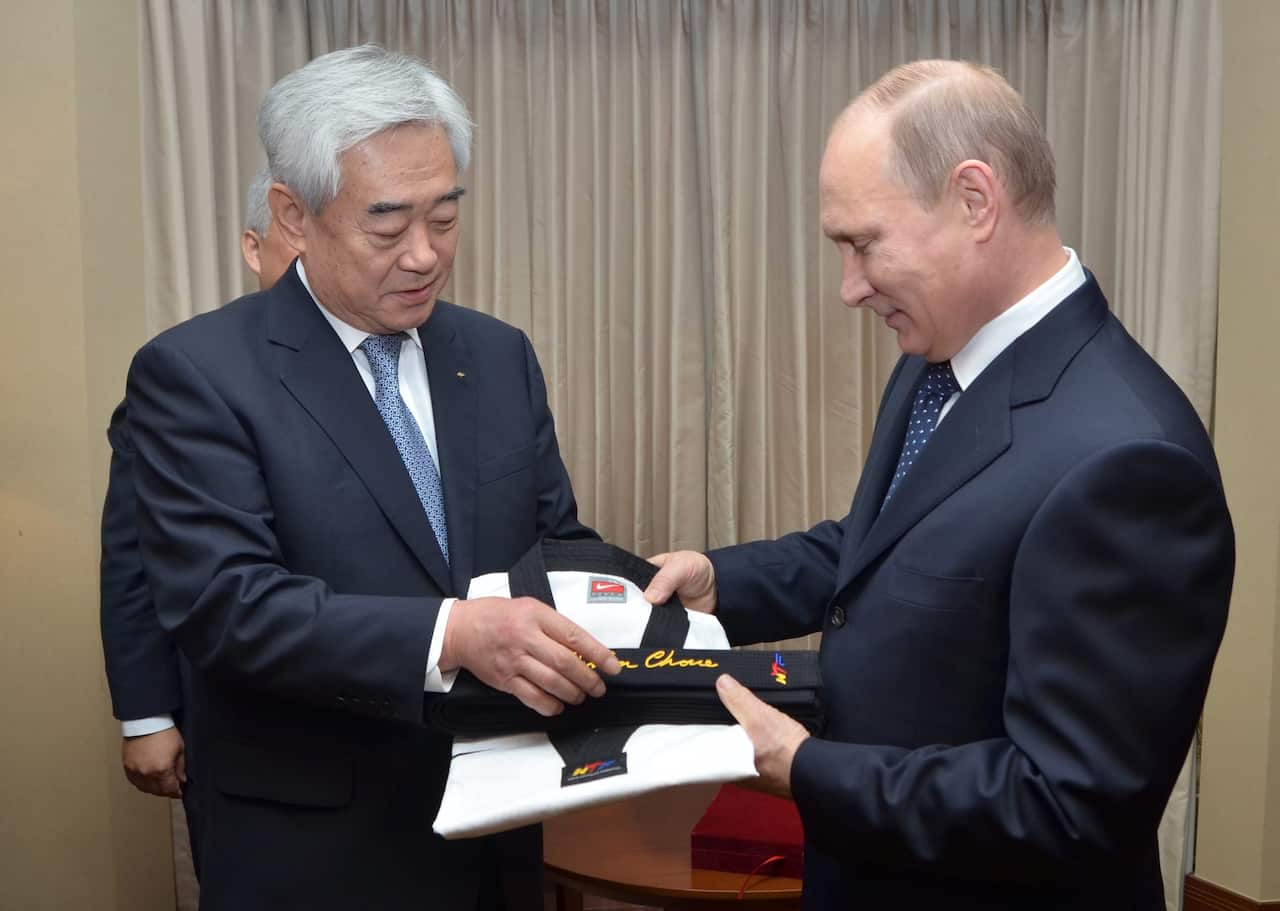 Russian President Vladimir Putin received a black belt and a uniform from Choue Chung-won, president of the World Taekwondo Federation on 13 November 2013.