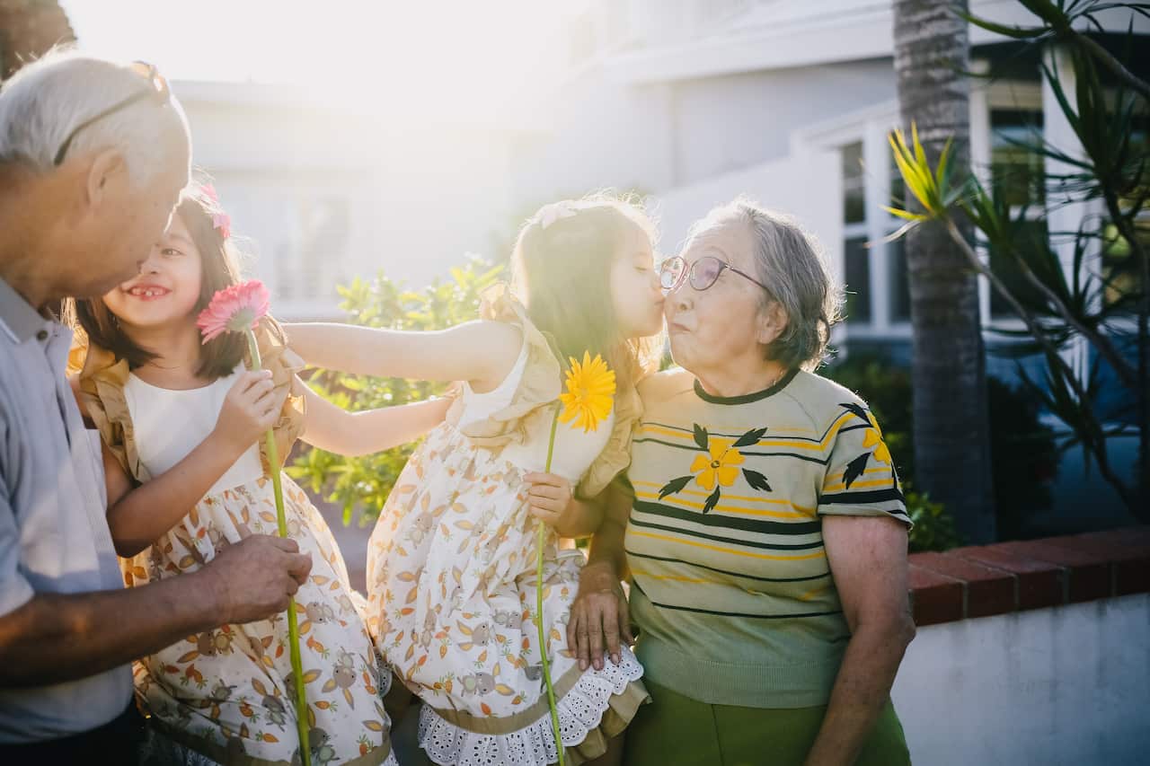 Family,grandparents-asian grandaughters kissing their grand parents-Pexels-Rodnae Productions.jpg