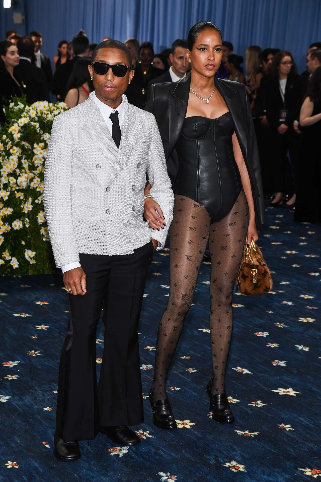 Pharrell Williams and Helen Lasichanh arrive at the Met gala