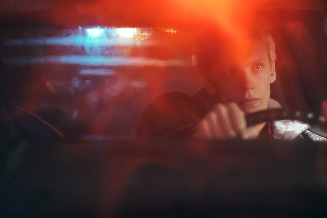 Actor Freddie Wise driving in a car at night.jpg