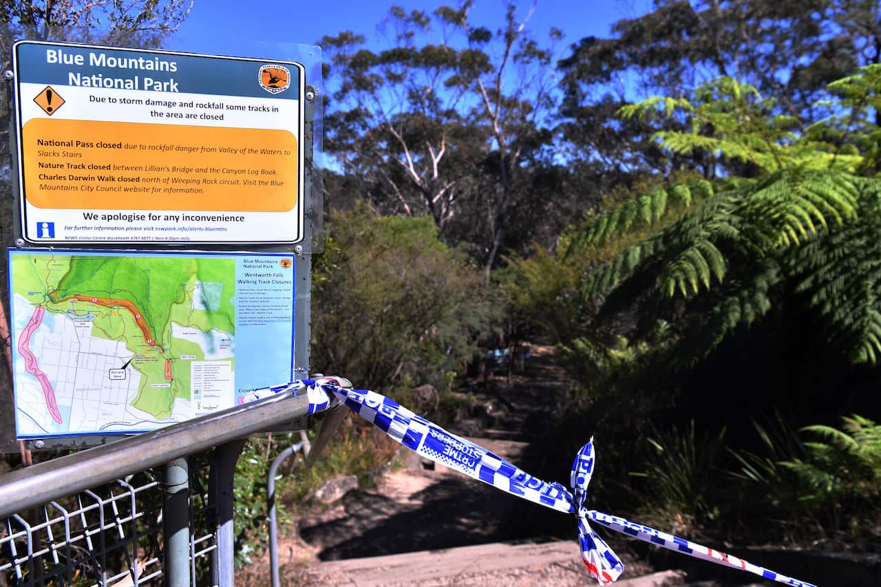 The taped off entrance to the walking track where a landslide killed two and injured two others at Wentworth Falls in the Blue Mountains, NSW, west of Sydney.